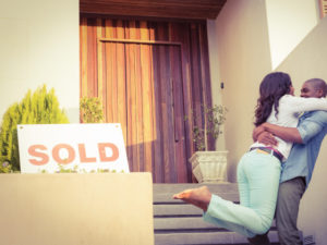 home-for-sale-with-couple-hugging